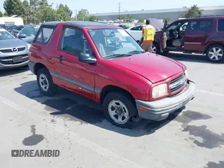 1999 Chevrolet Tracker z VIN 2CNBJ1865X6935435, wystawiony jako IAAI lot #42421108 z przebiegiem Nie podano mil oraz . Historia ofert i sprzedaży dostępna na DreamBid. Obrazek 1.