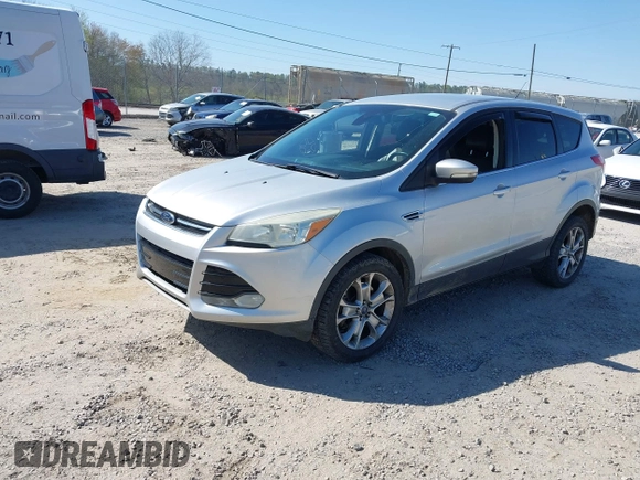 2013 Ford Escape SEL with VIN 1FMCU9H94DUA25017, listed as a IAAI auction lot 41976238 with 171,885 mi miles and . Bid and sale history available at DreamBid. Image 2.