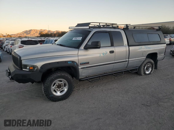 2000 Dodge 2500 z VIN 1B7KF2369YJ144753, wystawiony jako Copart lot #80801414 z przebiegiem 173 413 mil mil oraz Szkoda całkowita • Salvage title. Historia ofert i sprzedaży dostępna na DreamBid. Obrazek 1.