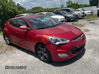 2016 Hyundai Veloster z VIN KMHTC6AD4GU258111, wystawiony jako Copart lot #61976895 z przebiegiem 184 105 mil mil oraz Czysty tytuł • Clean title. Historia ofert i sprzedaży dostępna na DreamBid. Obrazek 1.