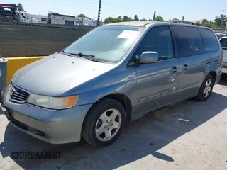 2001 Honda Odyssey EX z VIN 2HKRL18621H541553, wystawiony jako IAAI lot #42469447 z przebiegiem 241 701 mil mil oraz . Historia ofert i sprzedaży dostępna na DreamBid. Obrazek 2.