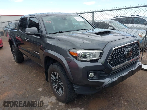 2018 Toyota Tacoma SR5 with VIN 3TMAZ5CN0JM061233, listed as a IAAI auction lot 41944668 with 94,314 mi miles and . Bid and sale history available at DreamBid. Image 1.