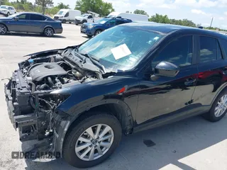 2014 Mazda CX-5 Sport with VIN JM3KE2BE9E0402015, listed as a IAAI auction lot 42098197 with 65,328 mi miles and . Bid and sale history available at carsss.com. Image 18.