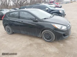 2014 Hyundai Accent GS with VIN KMHCT5AE6EU197814, listed as a IAAI auction lot 41697539 with 228,490 mi miles. Bid and sale history available at carsss.com. Image 1.