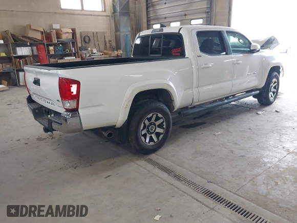 2016 Toyota Tacoma SR5 with VIN 3TMDZ5BN2GM007990, listed as a IAAI auction lot 41288736 with 76,179 mi miles. Bid and sale history available at carsss.com. Image 4.