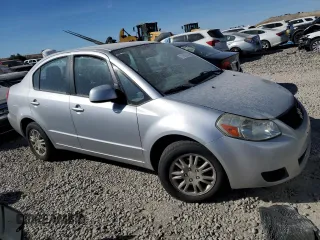 2013 Suzuki SX4 LE with VIN JS2YC5A31D6100472, listed as a Copart auction lot 73356934 with Not Provided miles and Salvage Title. Bid and sale history available at DreamBid. Image 4.