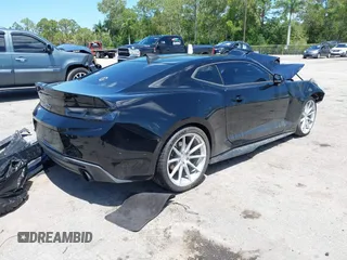2018 Chevrolet Camaro 1LT z VIN 1G1FB1RX8J0184852, wystawiony jako IAAI lot #42268638 z przebiegiem 99 610 mil mil oraz . Historia ofert i sprzedaży dostępna na DreamBid. Obrazek 4.