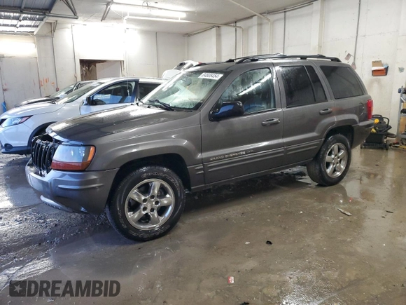 2004 Jeep Grand Cherokee Limited with VIN 1J8GX58N84C330702, listed as a Copart auction lot 84808454 with 164,426 mi miles and Salvage Title. Bid and sale history available at DreamBid. Image 1.