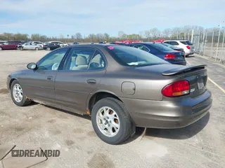 2000 Oldsmobile Intrigue GX z VIN 1G3WH52H0YF280823, wystawiony jako IAAI lot #42199925 z przebiegiem 102 427 mil mil oraz . Historia ofert i sprzedaży dostępna na DreamBid. Obrazek 3.