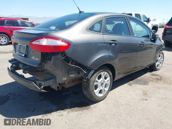 2015 Ford Fiesta SE with VIN 3FADP4BJ1FM217045, listed as a IAAI auction lot 42120444 with 119,207 mi miles and . Bid and sale history available at DreamBid. Image 4.