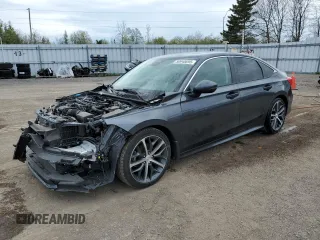 2022 Honda Civic Touring z VIN 2HGFE1F99NH007668, wystawiony jako Copart lot #50948695 z przebiegiem 49 978 mil mil oraz Szkoda całkowita • Salvage title. Historia ofert i sprzedaży dostępna na DreamBid. Obrazek 1.