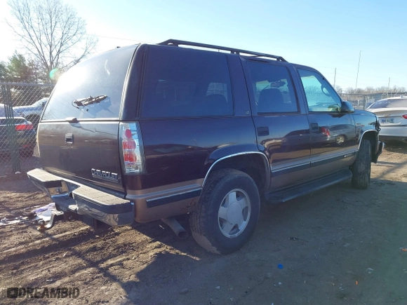 1996 Chevrolet Tahoe with VIN 1GNEK13R9TJ336722, listed as a IAAI auction lot 41576273 with 163,609 mi miles. Bid and sale history available at carsss.com. Image 4.