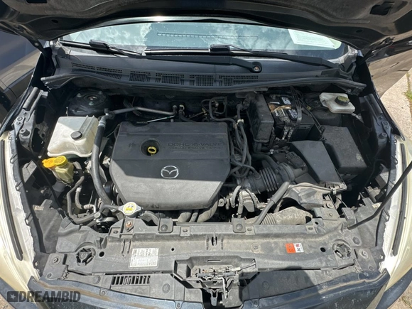 2015 Mazda Mazda5 Sport with VIN JM1CW2BLXF0182880, listed as a Copart auction lot 59904084 with 100,383 mi miles. Bid and sale history available at carsss.com. Image 7.