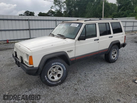 1996 Jeep Cherokee Sport z VIN 1J4FJ68S3TL103684, wystawiony jako Copart lot #63466265 z przebiegiem 163 715 mil mil oraz Czysty tytuł • Clean title. Historia ofert i sprzedaży dostępna na DreamBid. Obrazek 1.