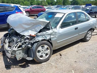 2003 Nissan Sentra XE z VIN 3N1CB51D43L714603, wystawiony jako IAAI lot #42392644 z przebiegiem 201 656 mil mil oraz . Historia ofert i sprzedaży dostępna na DreamBid. Obrazek 2.