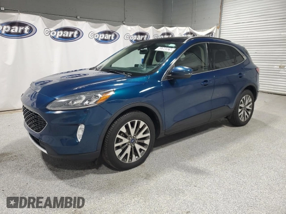 2020 Ford Escape Titanium z VIN 1FMCU9J98LUA93393, wystawiony jako Copart lot #65366925 z przebiegiem 74 750 mil mil oraz Czysty tytuł • Clean title. Historia ofert i sprzedaży dostępna na DreamBid. Obrazek 1.