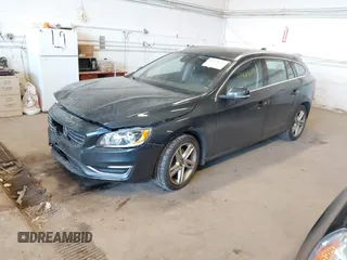 2015 Volvo V60 T5 Drive-E Premier with VIN YV140MEKXF1258073, listed as a IAAI auction lot 41428244 with 57,699 mi miles. Bid and sale history available at carsss.com. Image 2.