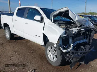 2018 GMC Canyon 4WD SLE z VIN 1GTG6CENXJ1204934, wystawiony jako IAAI lot #42124372 z przebiegiem 72 392 mil mil oraz . Historia ofert i sprzedaży dostępna na DreamBid. Obrazek 1.