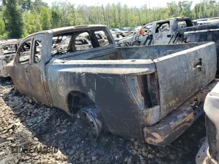 2010 Nissan Titan SE with VIN 1N6BA0CH0AN325143, listed as a Copart auction lot 66860214 with 77,033 mi miles and Salvage Title. Bid and sale history available at carsss.com. Image 2.