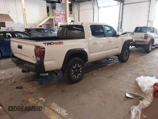 2021 Toyota Tacoma SR z VIN 5TFCZ5AN1MX268370, wystawiony jako IAAI lot #41922632 z przebiegiem 50 358 mil mil oraz . Historia ofert i sprzedaży dostępna na DreamBid. Obrazek 4.
