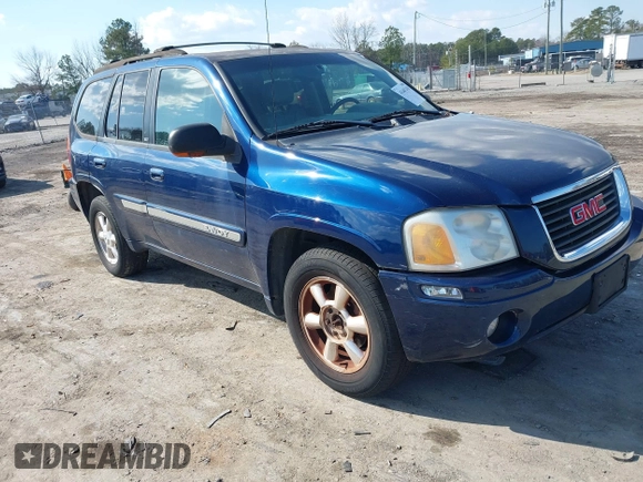 2003 GMC Envoy SLE with VIN 1GKDT13S432364768, listed as a IAAI auction lot 41467418 with 220,170 mi miles. Bid and sale history available at carsss.com. Image 1.