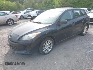 2012 Mazda Mazda3 i Touring with VIN JM1BL1L77C1559753, listed as a IAAI auction lot 42037094 with 145,659 mi miles. Bid and sale history available at carsss.com. Image 2.