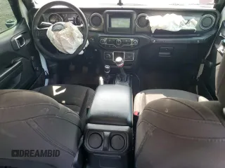 2023 Jeep Wrangler Sport with VIN 1C4HJXDGXPW596127, listed as a Copart auction lot 65395655 with 64,257 mi miles and Salvage title. Bid and sale history available at DreamBid. Image 8.