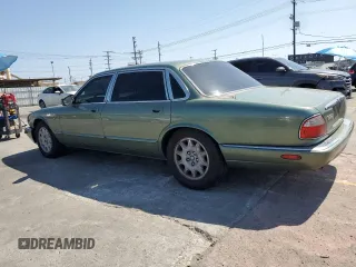 1999 Jaguar XJ with VIN SAJHX604XXC854217, listed as a Copart auction lot 56042735 with 127,092 mi miles and Salvage title. Bid and sale history available at DreamBid. Image 2.