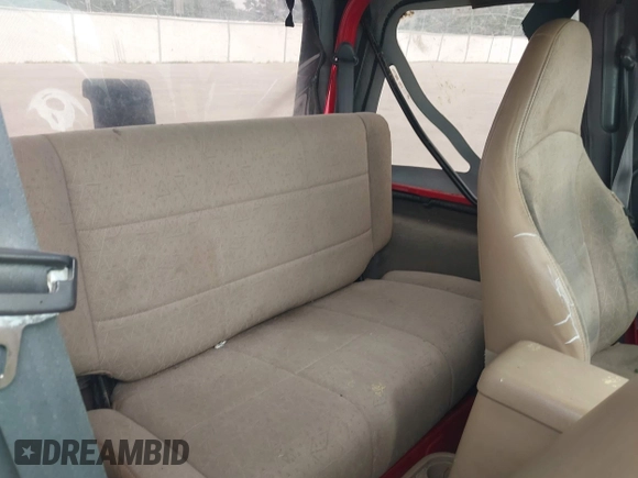 2001 Jeep Wrangler Sport z VIN 1J4FA49S31P335680, wystawiony jako IAAI lot #42471312 z przebiegiem 212 927 mil mil oraz . Historia ofert i sprzedaży dostępna na DreamBid. Obrazek 8.