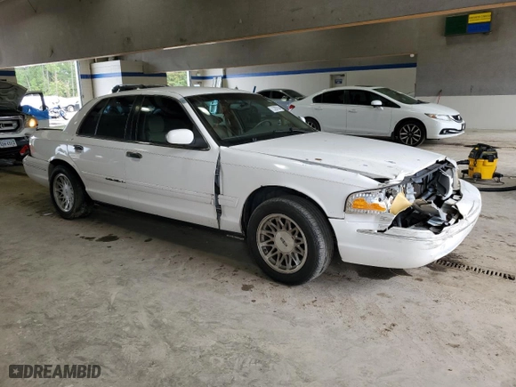 2003 Ford Crown Victoria LX with VIN 2FAFP74W23X134274, listed as a Copart auction lot 73295754 with 212,581 mi miles and Salvage Title. Bid and sale history available at carsss.com. Image 4.