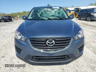 2016 Mazda CX-5 Sport with VIN JM3KE4BY8G0745522, listed as a Copart auction lot 56621825 with 98,757 mi miles and Salvage title. Bid and sale history available at DreamBid. Image 5.