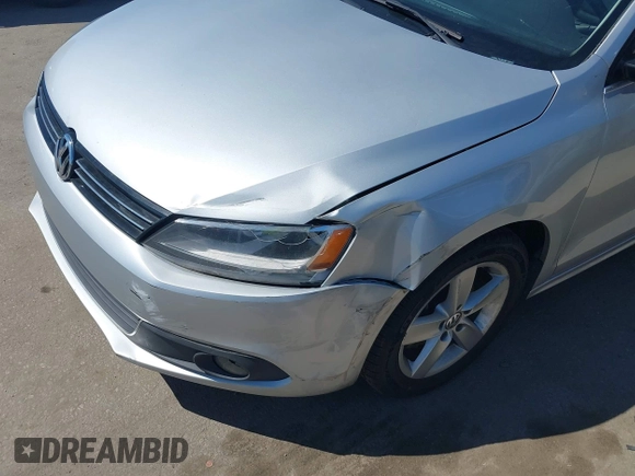 2012 Volkswagen Jetta TDI w/Premium with VIN 3VWLL7AJ8CM314305, listed as a IAAI auction lot 41885355 with 75,669 mi miles and . Bid and sale history available at DreamBid. Image 11.