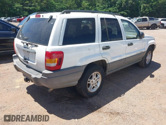 2002 Jeep Grand Cherokee Laredo with VIN 1J4GX48S32C134911, listed as a IAAI auction lot 42323138 with 156,852 mi miles and . Bid and sale history available at DreamBid. Image 4.