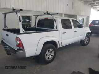 2009 Toyota Tacoma PreRunner with VIN 3TMJU62N49M090994, listed as a IAAI auction lot 41787065 with 207,386 mi miles. Bid and sale history available at carsss.com. Image 4.