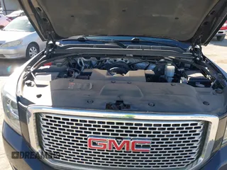 2015 GMC Yukon XL Denali with VIN 1GKS2JKJ9FR634771, listed as a IAAI auction lot 41676218 with 73,271 mi miles. Bid and sale history available at carsss.com. Image 10.