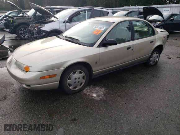 2001 Saturn SL z VIN 1G8ZH52851Z286886, wystawiony jako Copart lot #84883824 z przebiegiem Nie podano mil oraz Szkoda całkowita • Salvage title. Historia ofert i sprzedaży dostępna na DreamBid. Obrazek 1.