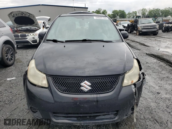 2011 Suzuki SX4 LE z VIN JS2YC5A28B6300625, wystawiony jako Copart lot #54044155 z przebiegiem 179 269 mil mil oraz Szkoda całkowita • Salvage title. Historia ofert i sprzedaży dostępna na DreamBid. Obrazek 5.
