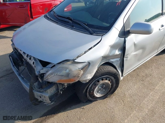 2010 Toyota Yaris with VIN JTDBT4K37A4076727, listed as a IAAI auction lot 41023533 with 102,494 mi miles. Bid and sale history available at carsss.com. Image 6.