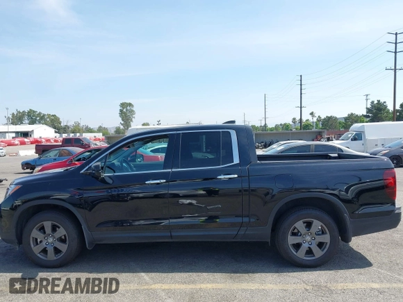 2020 Honda Ridgeline RTL-E with VIN 5FPYK3F70LB009376, listed as a IAAI auction lot 42488529 with 30,932 mi miles and . Bid and sale history available at DreamBid. Image 14.