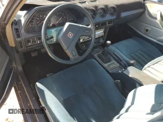 1979 Datsun 280ZX z VIN HS130133365, wystawiony jako Copart lot #77113584 z przebiegiem 99 721 mil mil oraz Szkody całkowita. Historia ofert i sprzedaży dostępna na DreamBid. Obrazek 8.
