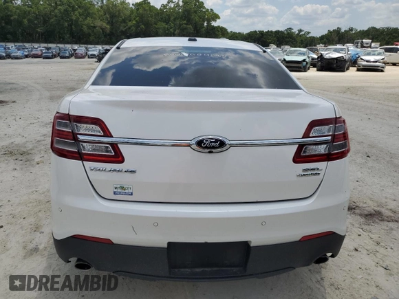 2016 Ford Taurus SEL z VIN 1FAHP2E86GG138691, wystawiony jako Copart lot #57495575 z przebiegiem Nie podano mil oraz Szkoda całkowita • Salvage title. Historia ofert i sprzedaży dostępna na DreamBid. Obrazek 6.