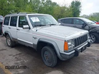 1991 Jeep Cherokee z VIN 1J4FJ58S3ML563620, wystawiony jako IAAI lot #42131093 z przebiegiem 198 942 mil mil oraz . Historia ofert i sprzedaży dostępna na DreamBid. Obrazek 1.