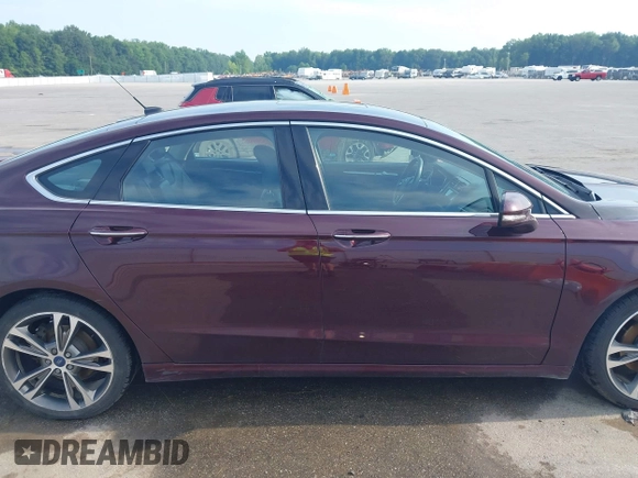 2017 Ford Fusion Titanium z VIN 3FA6P0K94HR271307, wystawiony jako IAAI lot #42595411 z przebiegiem 100 344 mil mil oraz . Historia ofert i sprzedaży dostępna na DreamBid. Obrazek 14.
