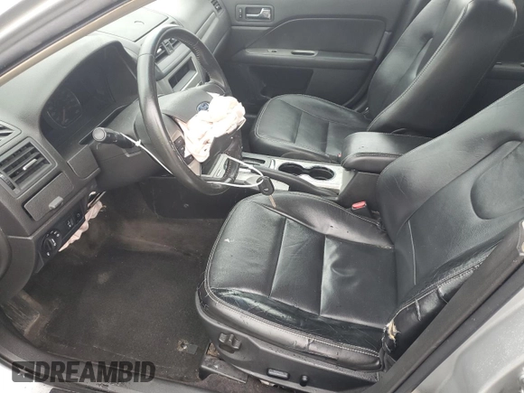 2010 Ford Fusion Hybrid z VIN 3FADP0L30AR122805, wystawiony jako Copart lot #52276255 z przebiegiem 146 073 mil mil oraz Szkoda całkowita • Salvage title. Historia ofert i sprzedaży dostępna na DreamBid. Obrazek 7.