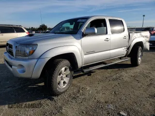 2011 Toyota Tacoma PreRunner with VIN 3TMJU4GN7BM114871, listed as a Copart auction lot 87256214 with 214,236 mi miles and Salvage Title. Bid and sale history available at DreamBid. Image 1.
