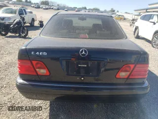 1997 Mercedes-Benz E-Class with VIN WDBJF72F0VA189407, listed as a Copart auction lot 76073234 with 114,692 mi miles and Salvage Title. Bid and sale history available at carsss.com. Image 6.