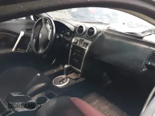 2005 Hyundai Tiburon GT z VIN KMHHN65F45U184777, wystawiony jako IAAI lot #42190342 z przebiegiem 213 013 mil mil oraz . Historia ofert i sprzedaży dostępna na DreamBid. Obrazek 5.
