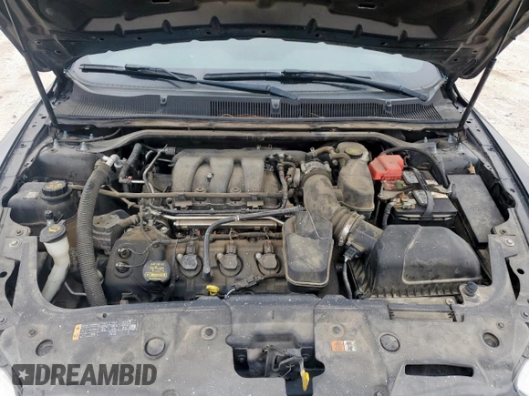 2014 Ford Taurus SEL z VIN 1FAHP2E84EG133955, wystawiony jako Copart lot #56630155 z przebiegiem 113 045 mil mil oraz Szkoda całkowita • Salvage title. Historia ofert i sprzedaży dostępna na DreamBid. Obrazek 11.