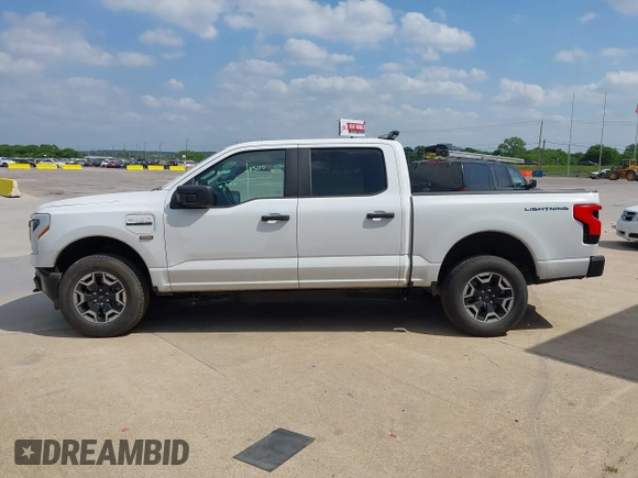 2023 Ford F-150 Lightning Pro with VIN 1FTVW1EL2PWG18764, listed as a IAAI auction lot 41908278 with 16,276 mi miles and . Bid and sale history available at DreamBid. Image 14.