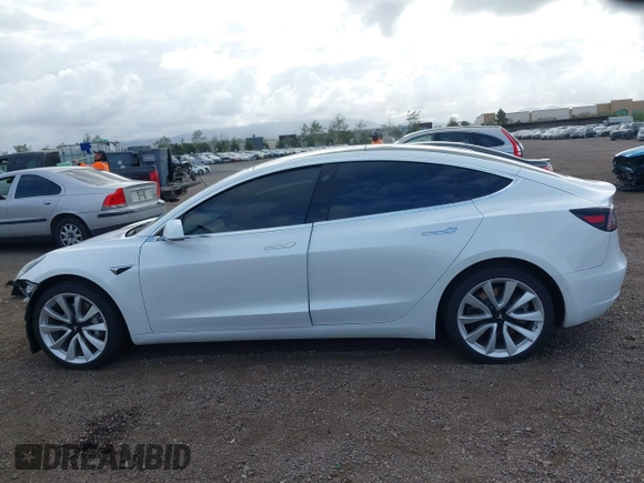 2019 Tesla Model 3 Long Range with VIN 5YJ3E1EBXKF512710, listed as a IAAI auction lot 42063737 with 90,721 mi miles and . Bid and sale history available at DreamBid. Image 15.